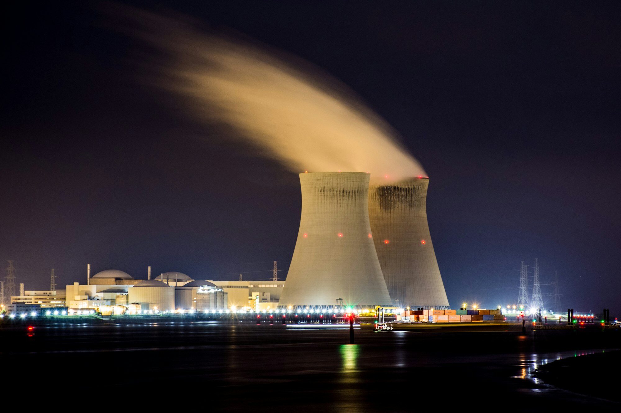 Generating station cooling towers lit at night